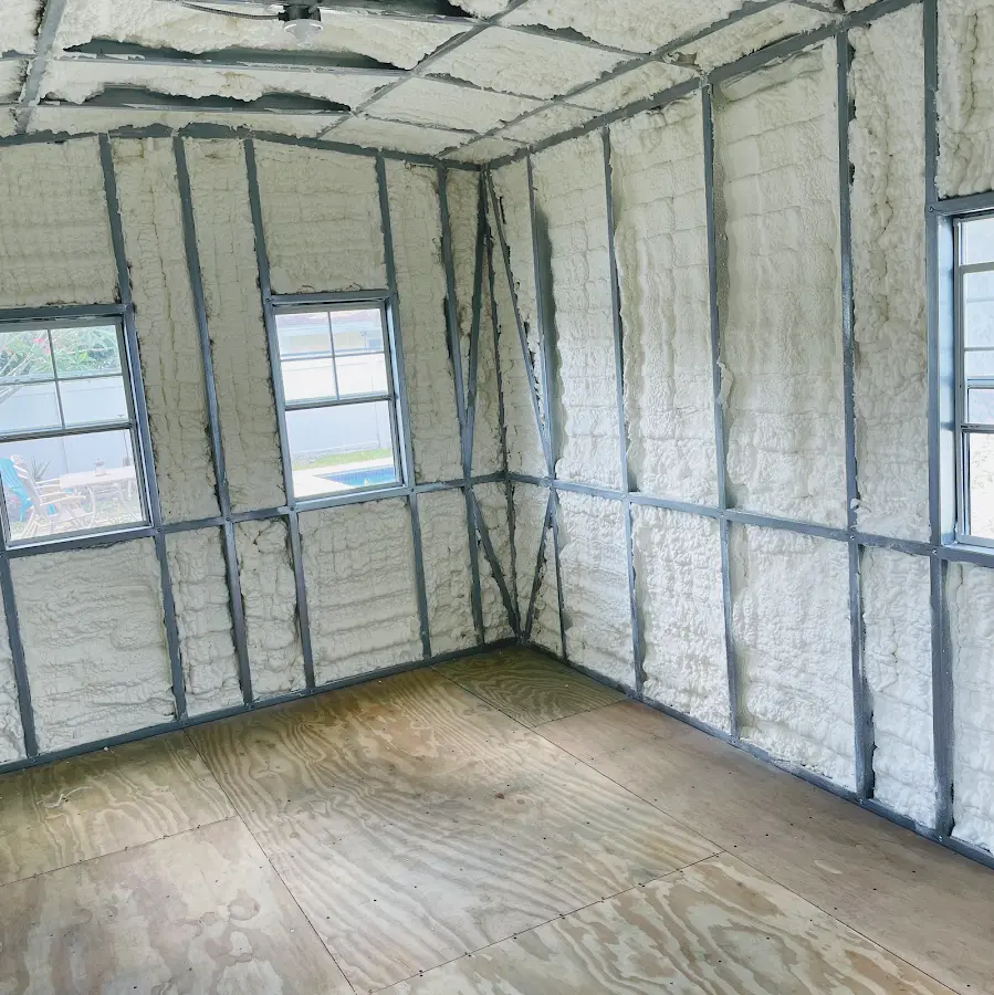 Closed-cell spray foam insulation applied to wall cavities in a residential project in Kimberly